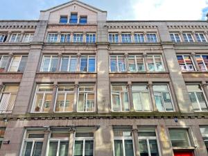 a large building with many windows on the side of it at 8 Stanley Street Apart-Hotel in Liverpool