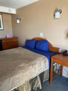 Postel nebo postele na pokoji v ubytování Taber Motel