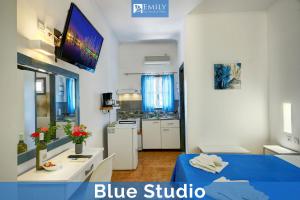 a living room with a blue studio apartment at Emily Apartments Dassia in Dassia