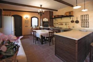 a kitchen with a table and a dining room at A Casa di Ludo - Apartments & Short Lets in Catania