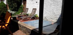 a view of a patio with chairs and a table at Ubytovanie v Banskej Štiavnici u Antalov in Banská Štiavnica