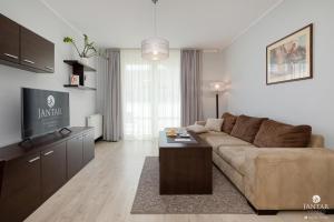 TV a/nebo společenská místnost v ubytování Jantar Apartamenty - AQUARIUS Apartamenty