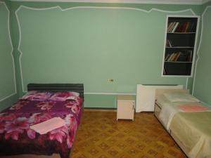 Postel nebo postele na pokoji v ubytování Royal Boutique Hotel on Kievyan