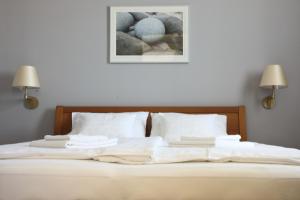 Posteľ alebo postele v izbe v ubytovaní Vita Apartmanok