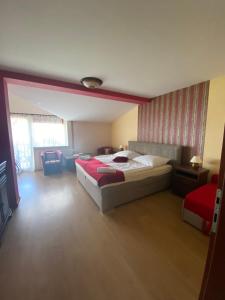 A bed or beds in a room at Konsky Dvor