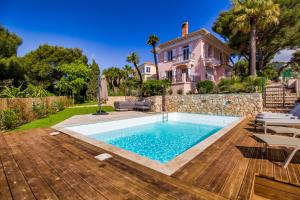 a swimming pool in the backyard of a house at Stunning seaview villa. Villefranche Sur Mer in Villefranche-sur-Mer