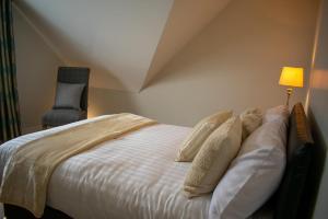 Voodi või voodid majutusasutuse Drumlanaught Cottage Farnham toas
