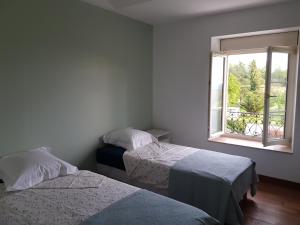 מיטה או מיטות בחדר ב-VILLA CHAMPAGNE