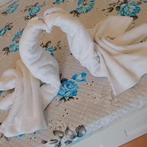 a group of towels sitting on top of a bed at I 23 PASSI GAETA in Gaeta +55 photos