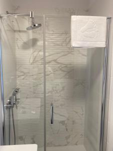 a shower with a glass door in a bathroom at Bel Mare II 428 in Międzyzdroje