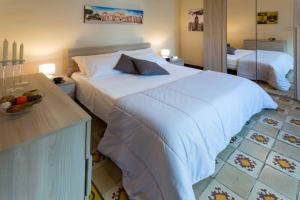Posteľ alebo postele v izbe v ubytovaní Siciliabedda Catania Holiday House