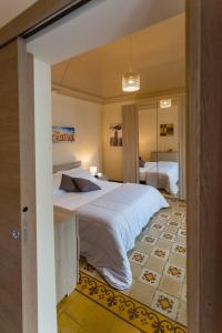 Posteľ alebo postele v izbe v ubytovaní Siciliabedda Catania Holiday House