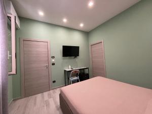 Televízia a/alebo spoločenská miestnosť v ubytovaní i Giardini di Rita- Rooms & Garden Loft