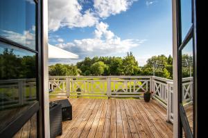 a view from the porch of a house at Dwór Meluzyna in Janowiec +43 photos