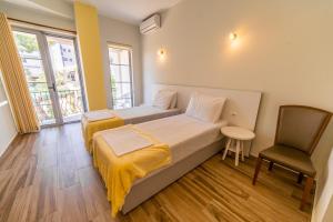 Postel nebo postele na pokoji v ubytování Hotel NEBO