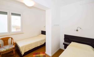 Postel nebo postele na pokoji v ubytování Apartment Pula 45