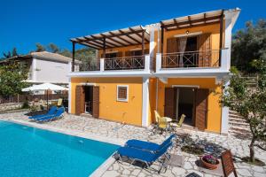 a villa with a swimming pool and a house at DELPHINUS VILLAS-Villa Nikitas in Agios Nikitas