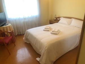 Posteľ alebo postele v izbe v ubytovaní Apartamento con vistas en Baiona