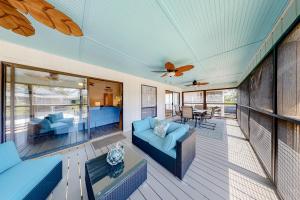 Et opholdsområde på Pelican Kiss Beach Cottage