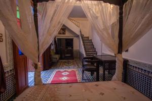 Postel nebo postele na pokoji v ubytování Riad Naila & suite
