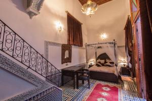 Postel nebo postele na pokoji v ubytování Riad Naila & suite