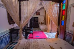 Postel nebo postele na pokoji v ubytování Riad Naila & suite