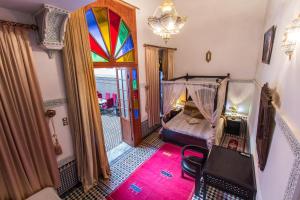 Postel nebo postele na pokoji v ubytování Riad Naila & suite