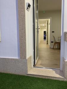 a hallway of a building with a glass door at Apartamentos San Lazaro in Santiago de Compostela