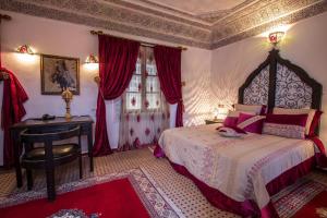 Postel nebo postele na pokoji v ubytování Riad Naila & suite