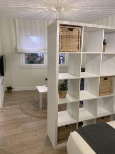 TV a/nebo společenská místnost v ubytování Apartamentos San Lazaro
