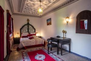 Postel nebo postele na pokoji v ubytování Riad Naila & suite
