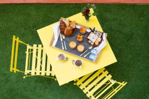 an overhead view of a table with a tray of donuts at Boutique Hotel Nice Côte d'azur in Nice +30 photos