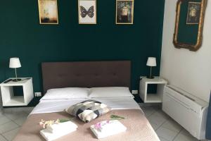 a bedroom with a large bed with two night stands at Bologna Central Apartments - Indipendenza 43 in Bologna