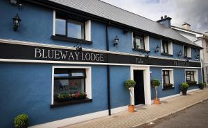 a building with a sign on the front of it at The Leitrim Inn and Blueway Lodge in Leitrim