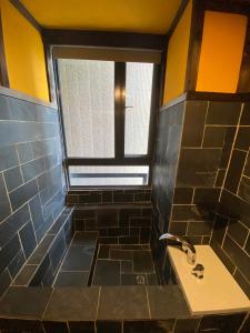 a bathroom with a sink and a window at Yong Guan in Yuchi