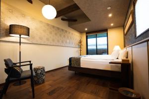 Postel nebo postele na pokoji v ubytování 谷町君・星屋・城下の宿