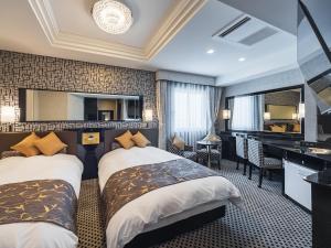Tempat tidur dalam kamar di APA Hotel Nishifunabashi Ekimae