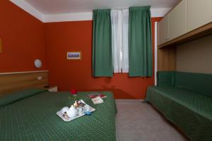 מיטה או מיטות בחדר ב-Hotel Turandot