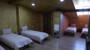 A bed or beds in a room at Lime Hotel & Restaurant Complex