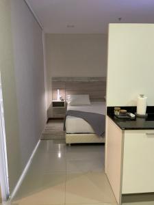 Ένα ή περισσότερα κρεβάτια σε δωμάτιο στο Asuncion Gracia Suites