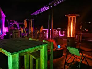 a table and chairs on a patio at night at Hotel Bayern Vital in Bad Reichenhall