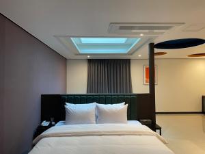 Llit o llits en una habitació de Hotel Quatz