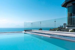 a swimming pool with a view of the ocean at La Boutique Hotel & Suites in Antalya