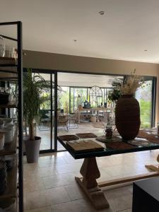 a living room with a table with a vase on it at Casa Di l'Ortu in Ajaccio