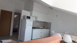 Kuchyň nebo kuchyňský kout v ubytování Apartman Sobe Magdalena