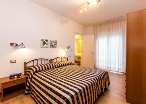Postel nebo postele na pokoji v ubytování Hotel Arizona