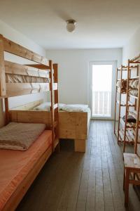 a bedroom with two bunk beds in it at Dom na Slivnici in Cerknica