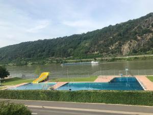 a large body of water with a slide in it at Villa Evin in Kamp-Bornhofen