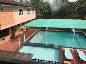 an overhead view of a swimming pool in a building at Felicitas Tagaytay in Tagaytay