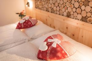 Voodi või voodid majutusasutuse Garni Le Prealpi toas